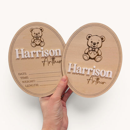 Two wooden baby milestone boards with teddy bear design and engraved name