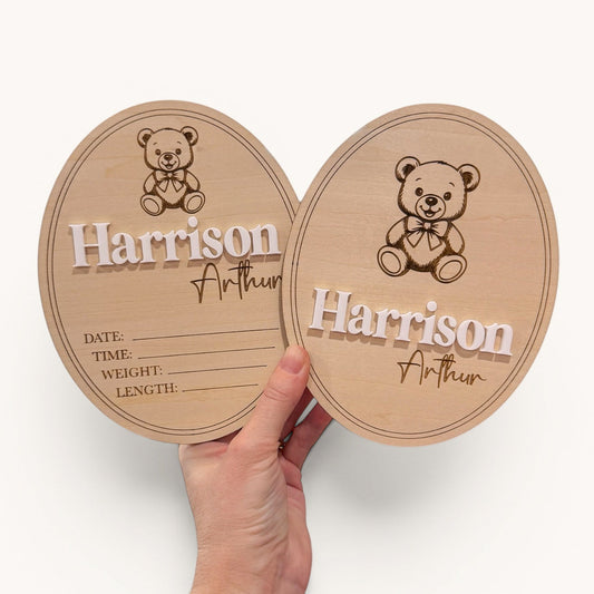 Two wooden baby milestone boards with teddy bear design and engraved name